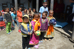 Children in Jomsom receiving gifts from Boston (including a “New Englad Revolution” soccer ball)
